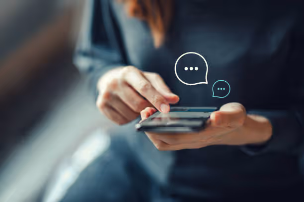 An user scrolling over her phone to check on the customer comments on different brands