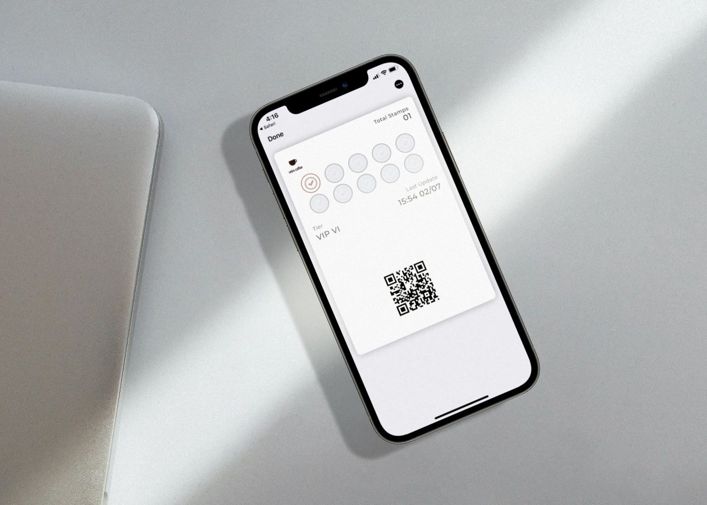 Digital Stamp Card 2 flat lay sunlighted iphone 13 pro graphite on white table with macbook mockup template